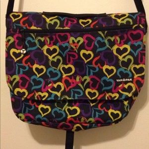 Yak Pak heart multi colored cross body book bag